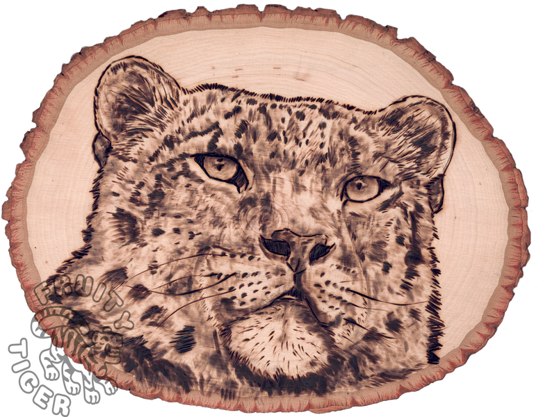 Snow leopard woodburning on live wood