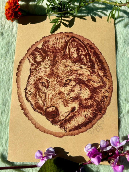 Woodburning print of wolf on kraft paper